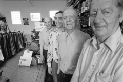 Four generations of clothiers man the counter at a small department store, western Upper Peninsula; 1976.Guide to Michigan; 1976. West UP.